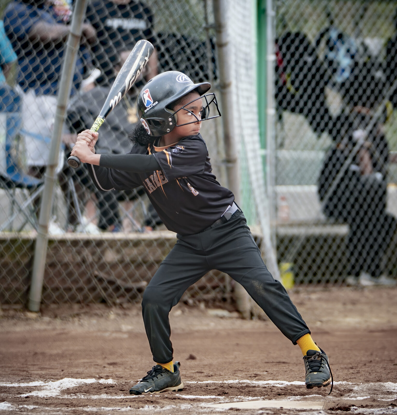 Noah loaded in the box, bat back, gold socks, locked in