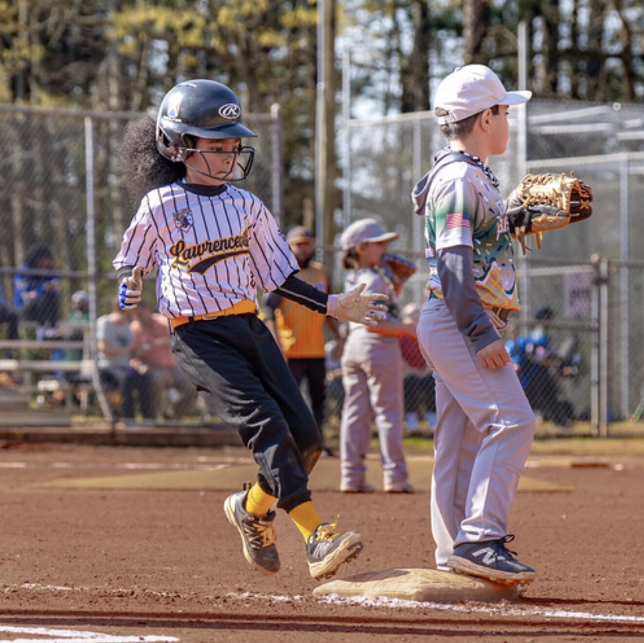 Noah on first base, eyes on the next play